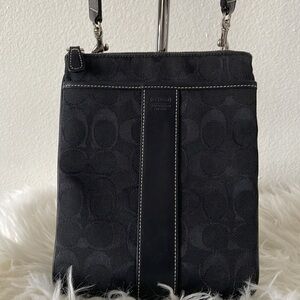 Black Coach crossbody logo purse. Size 7”W x 9”L. Canvas and leather. EUC.